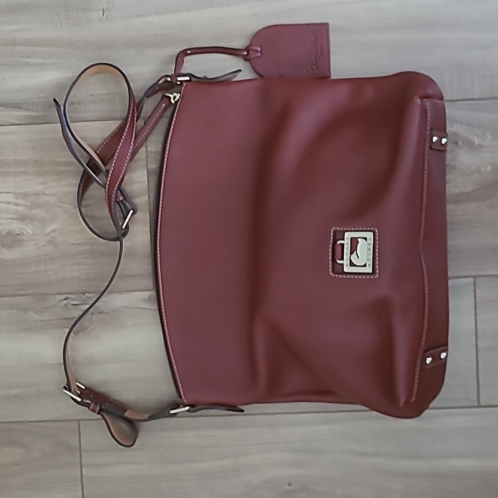 Authentic Dooney & Bourke Pebble Grain Cross-body Burgundy color